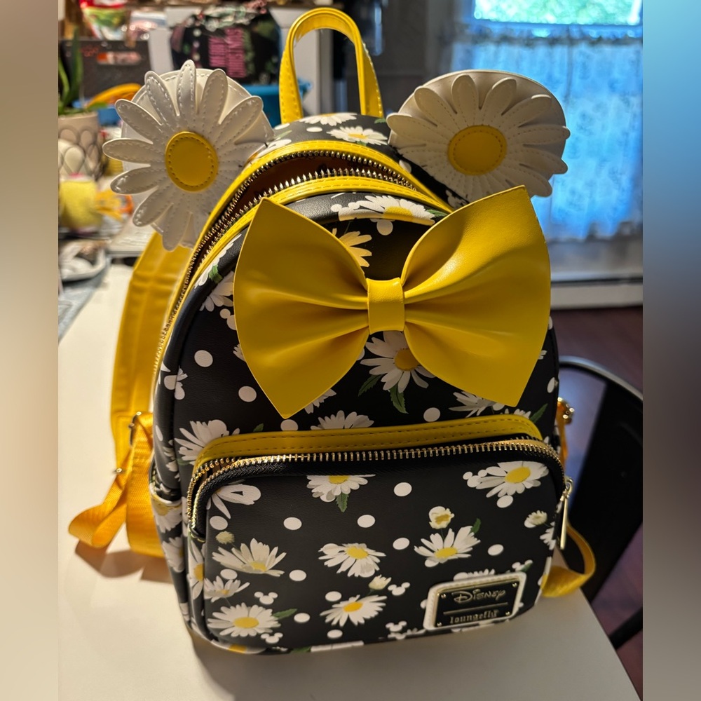 Loungefly Black and Yellow Mini Backpack with Daisy Print